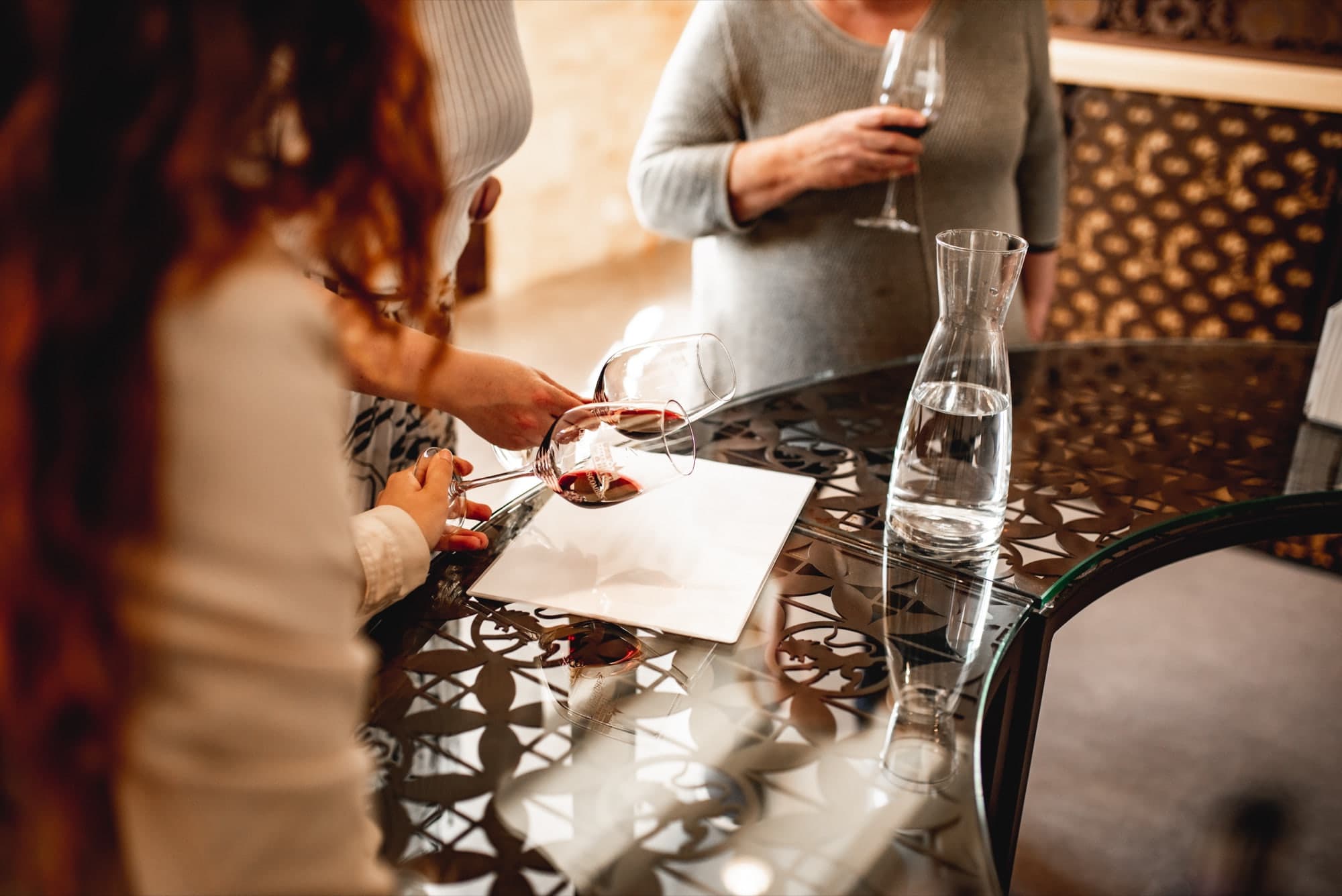 Wine poured for guests during a château tasting